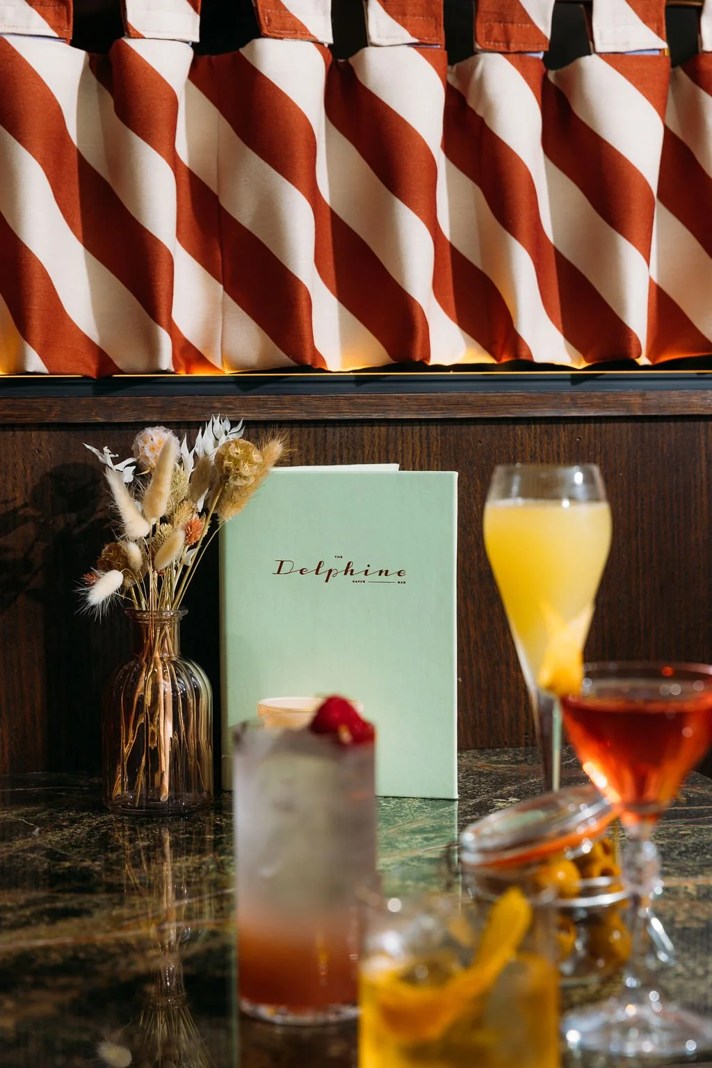 The Delphine — sage-walled dining room, Glasgow