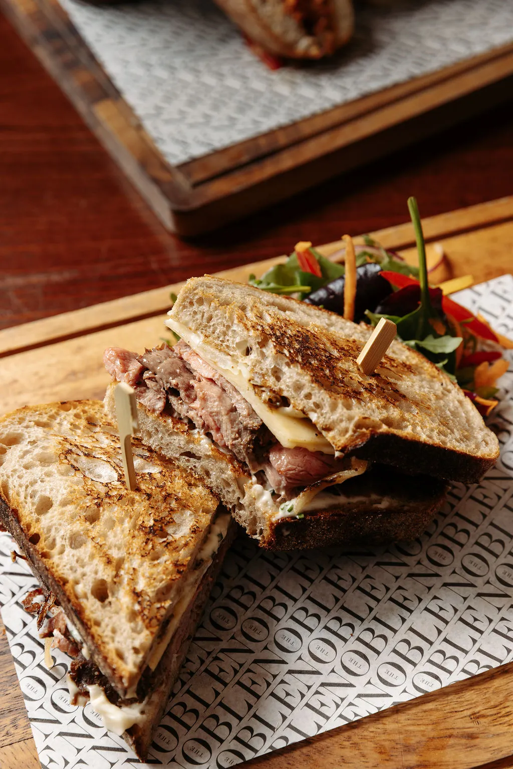 The Noble Public House — branded paper and sandwich detail