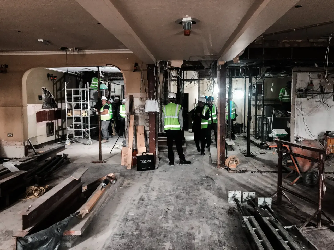 Site strip-out in progress — crew on the floor in week one of a fit out
